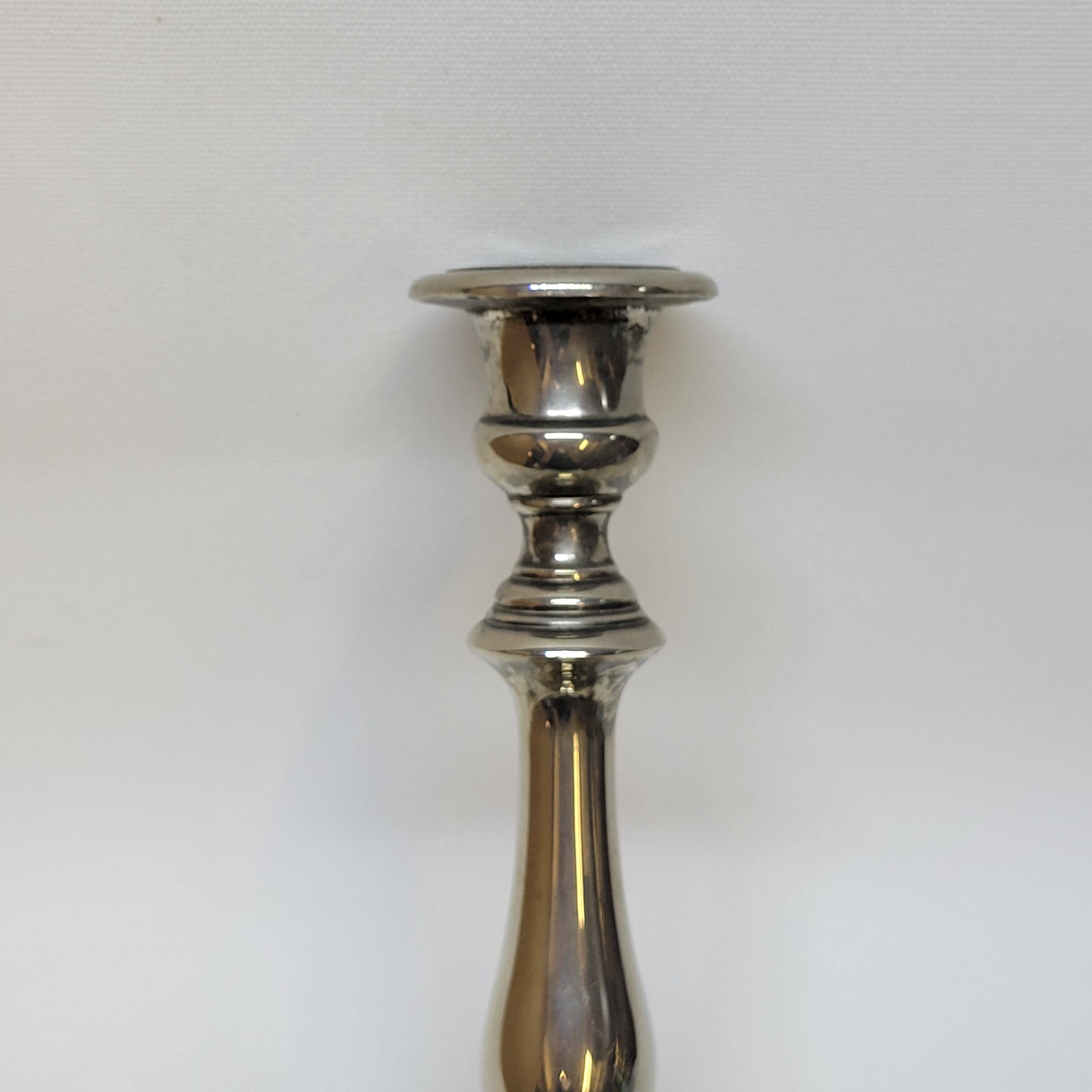 Old candle holder in silver metal