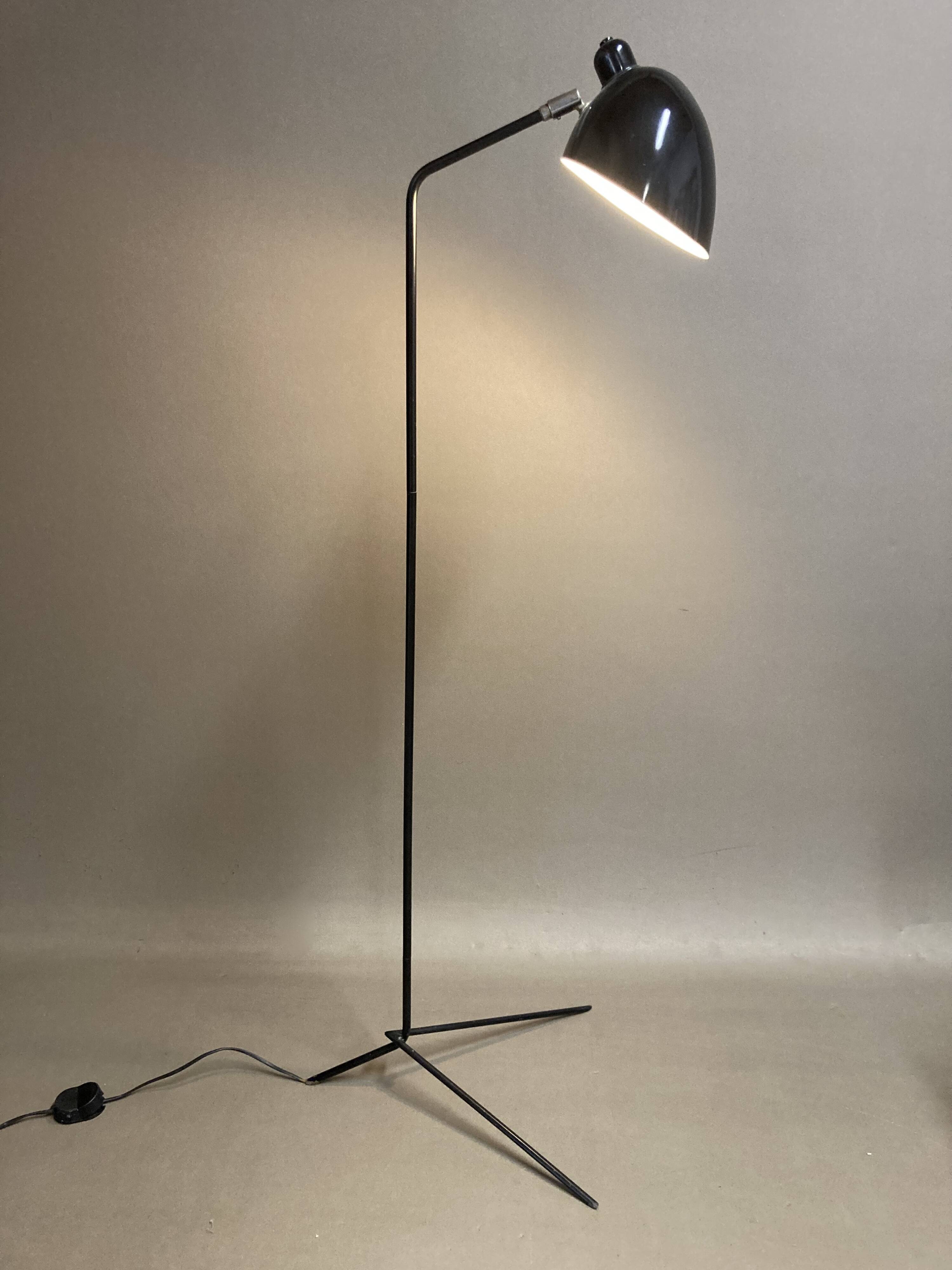 Black metal tripod floor lamp
