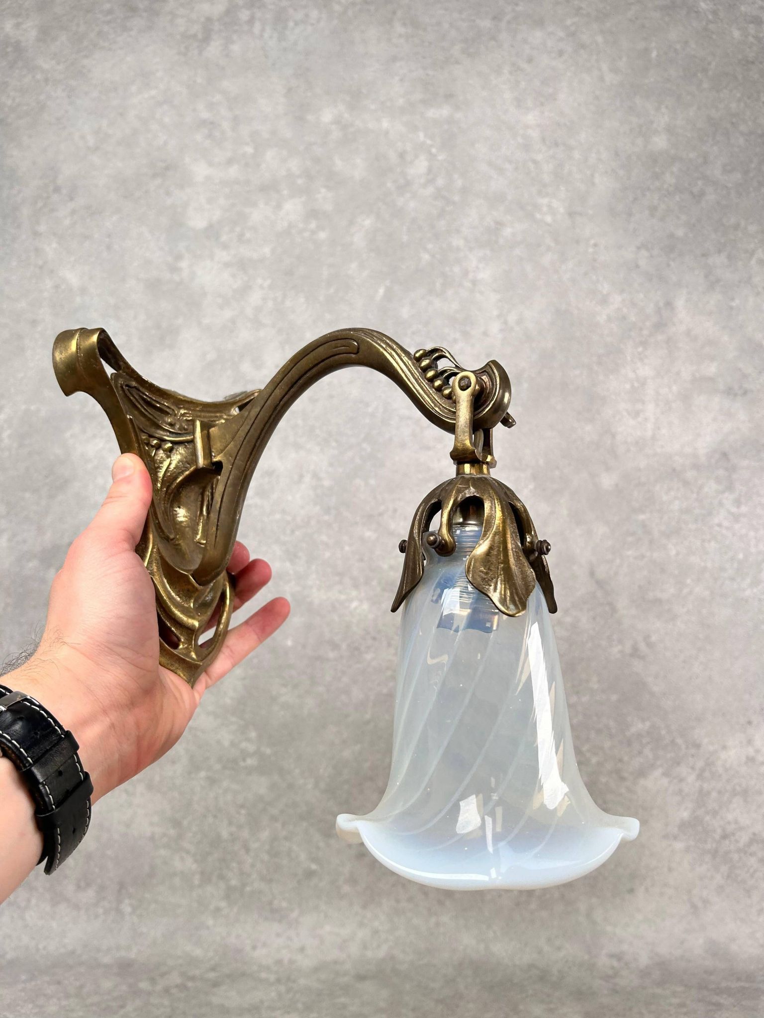 Art Nouveau wall sconces with opalescent iridescent glass