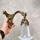 Art Nouveau wall sconces with opalescent iridescent glass