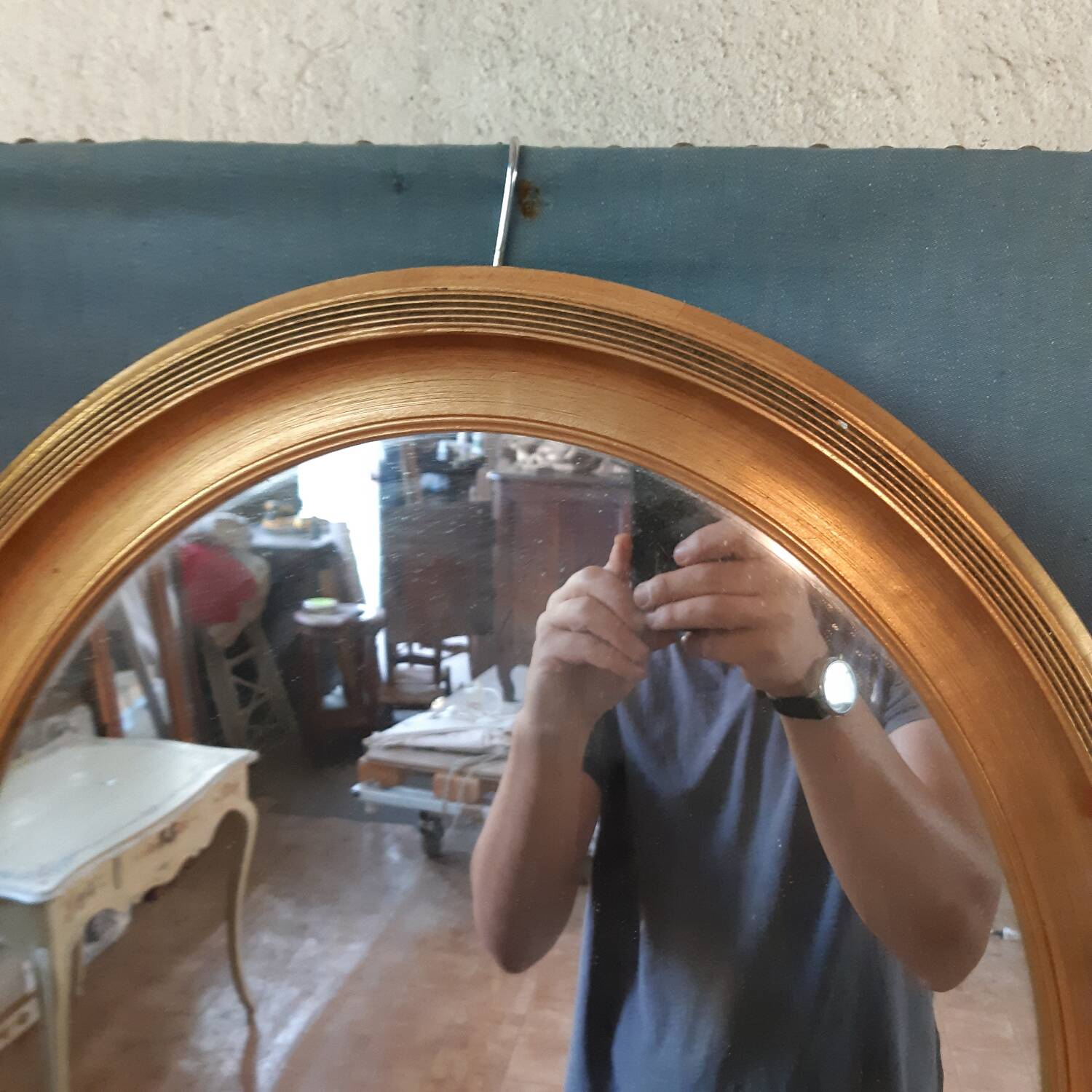 Pair of golden oval mirrors