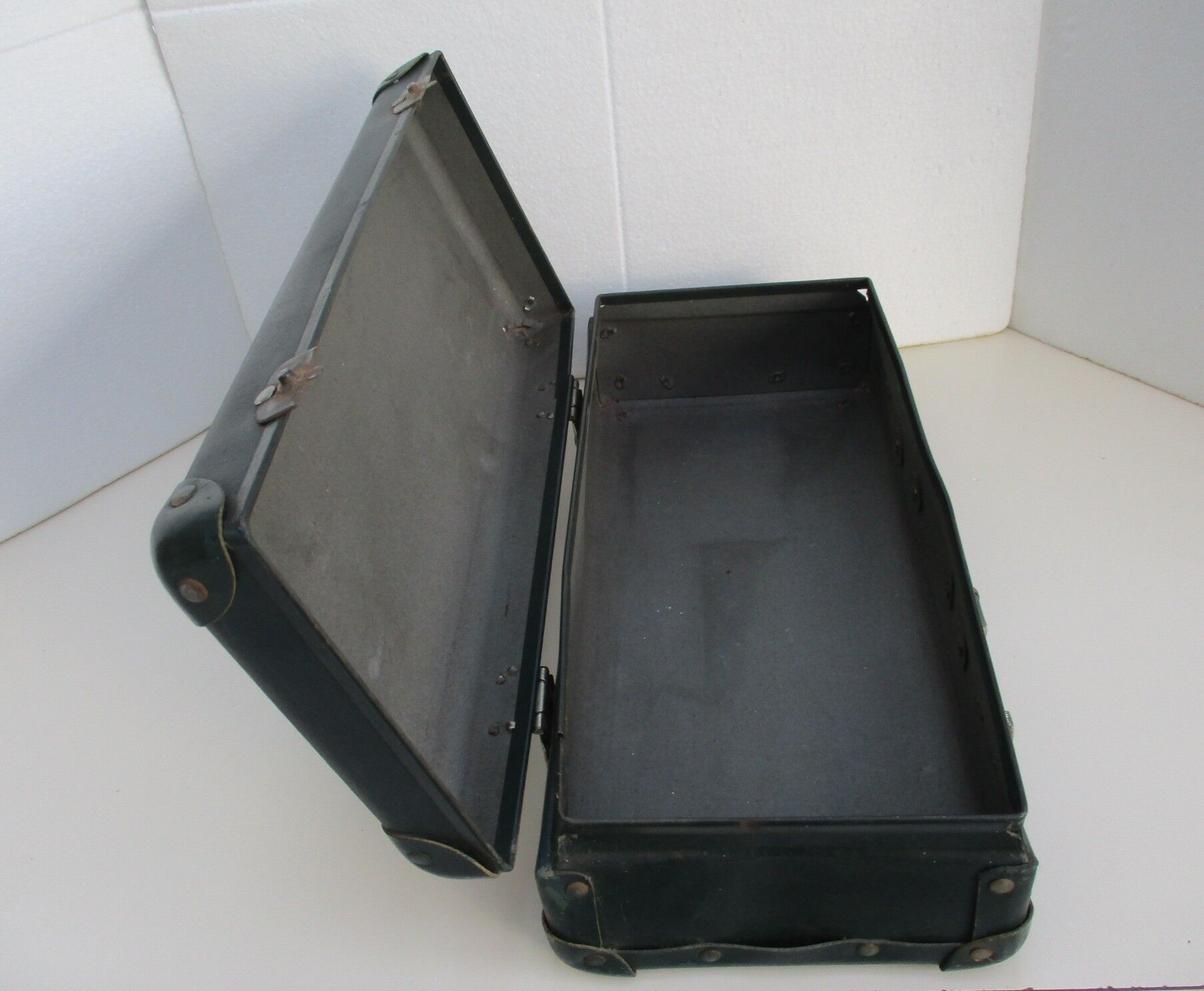 Vintage green cardboard suitcase