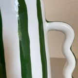 Green and white striped ceramic vase with abstract handmade corrugated handheld