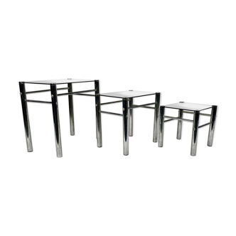 Tables in chrome metal and tinted glass. year 70