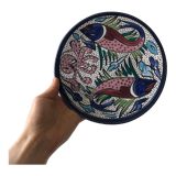 4 colorful flat plates with a fish pattern