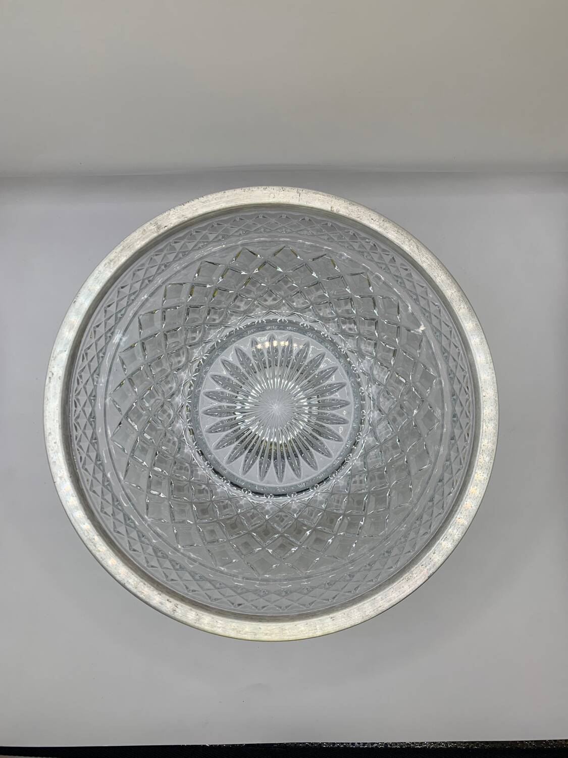 Chiseled glass (crystal?) salad bowl with silver metal edge