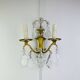 Bronze wall light with rococo style Louis XV pendants.