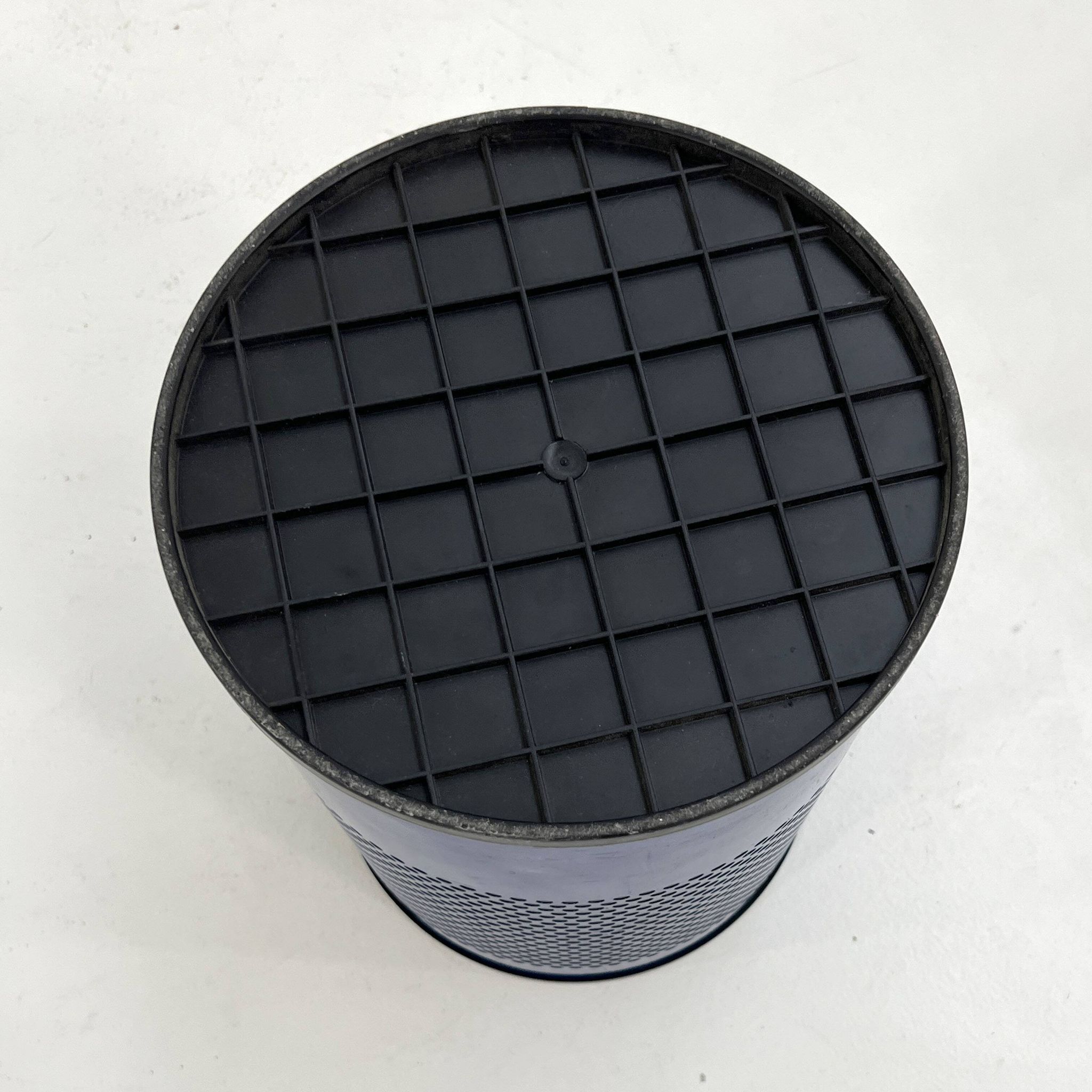 Blue perforated metal bin, 1980