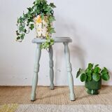 Antique tripod stool made of solid wood in blue.