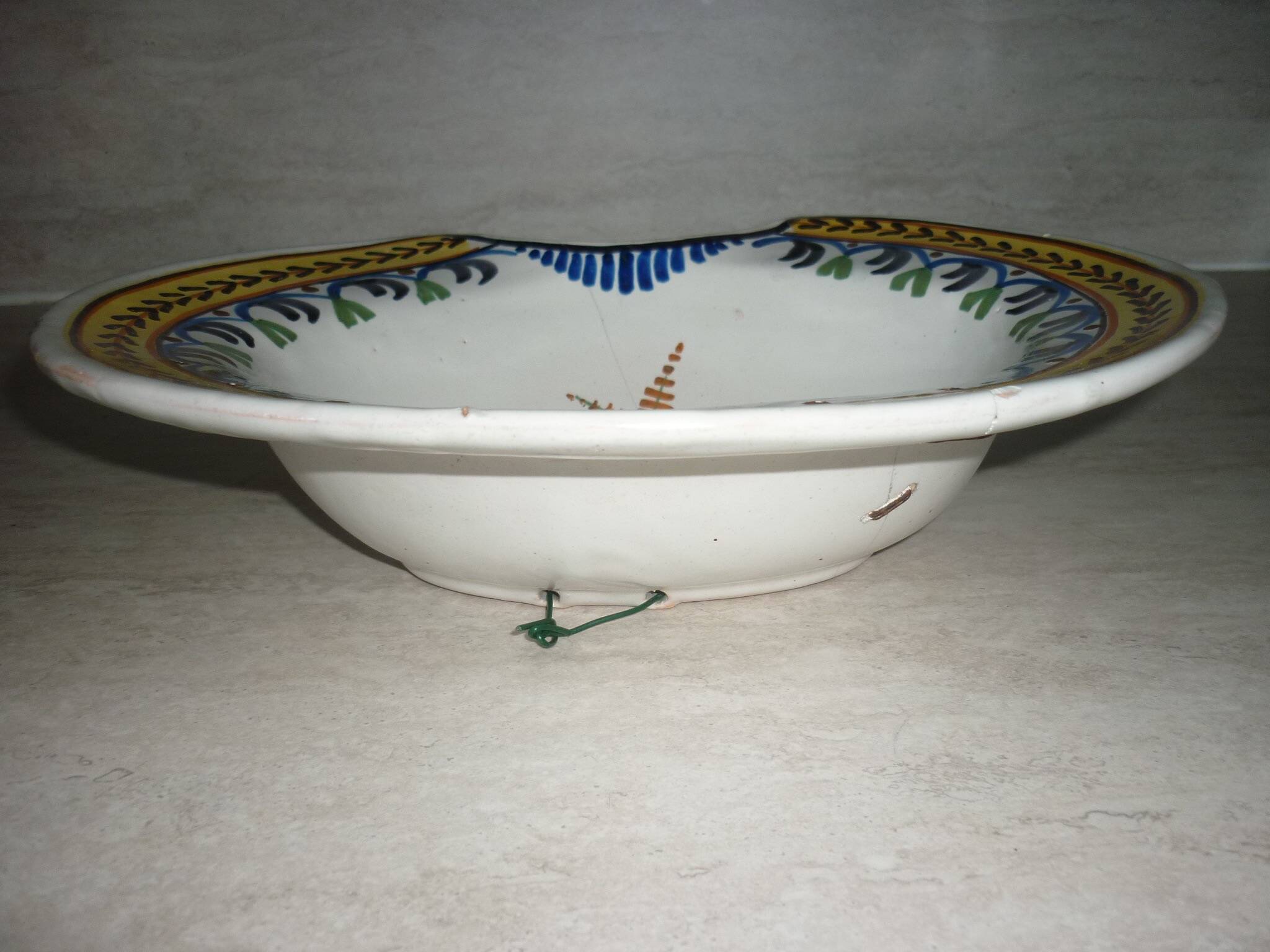 Old beard dish repair with staples