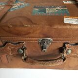 suitcase of leather with labels of palaces