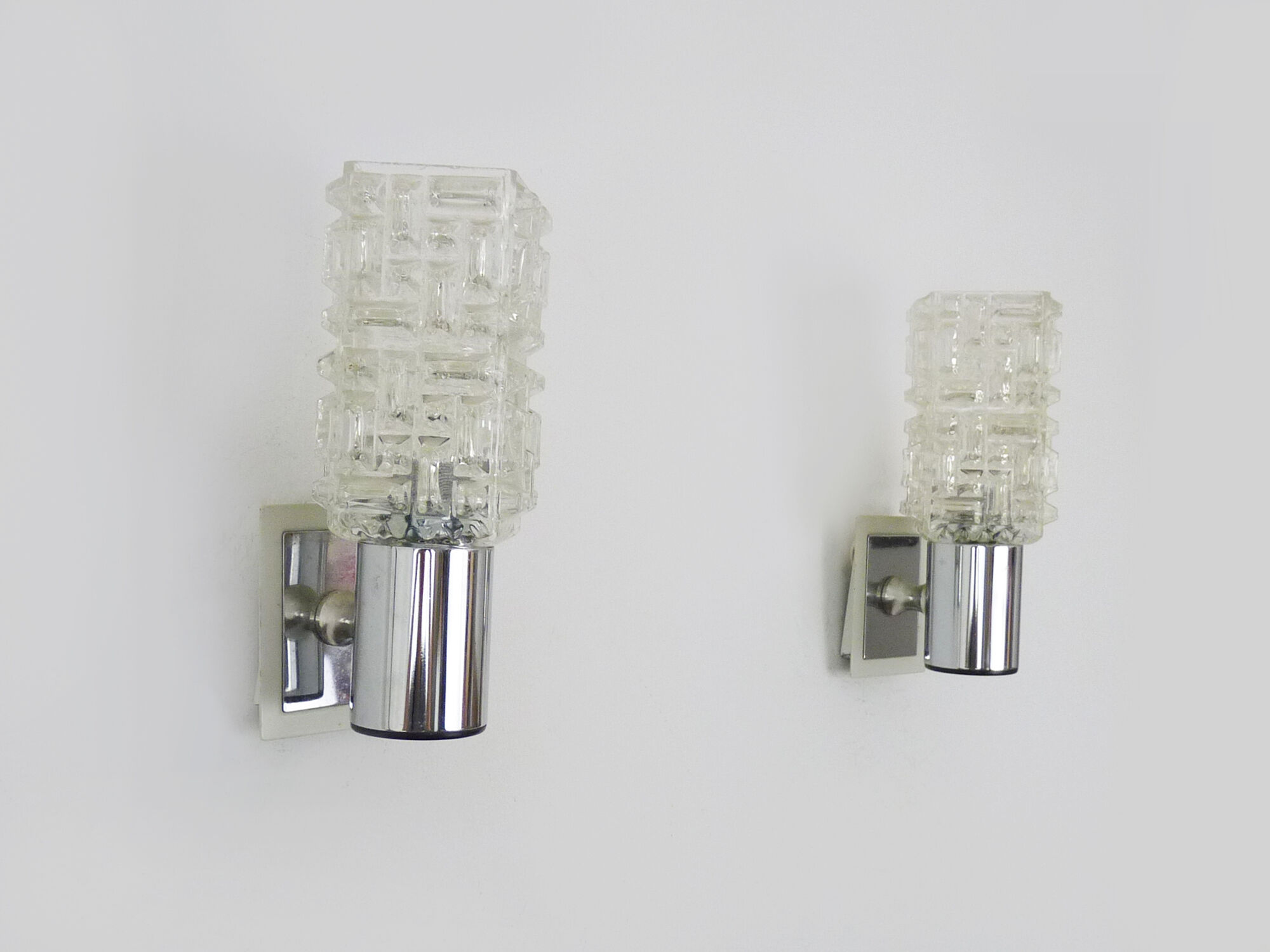 Pair of space age wall sconces, stainless steel and thick glass, 60s 70s