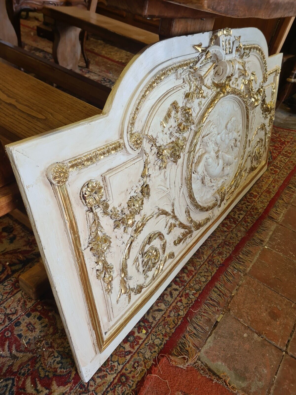 Pediment panel with stucco and wood angels