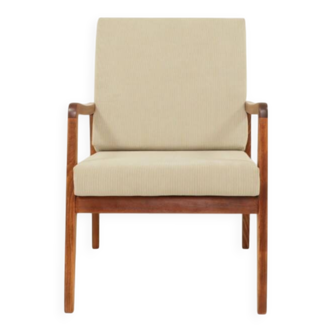Vintage armchair in olive corduroy with a wooden frame.