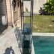Bauhaus style bookcase with modular wall shelf, glass and chrome