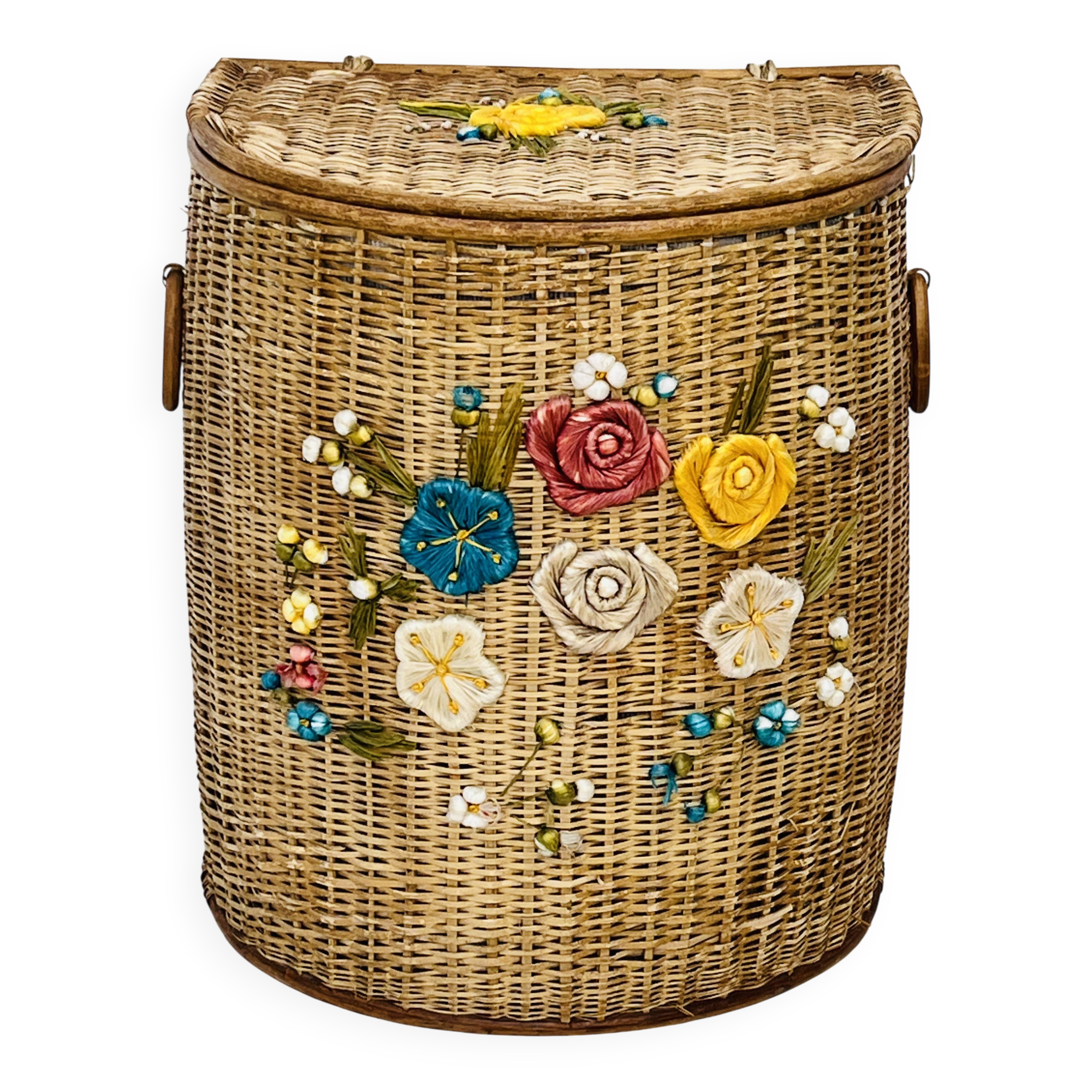 Vintage wicker mannequin with colourful floral decoration.