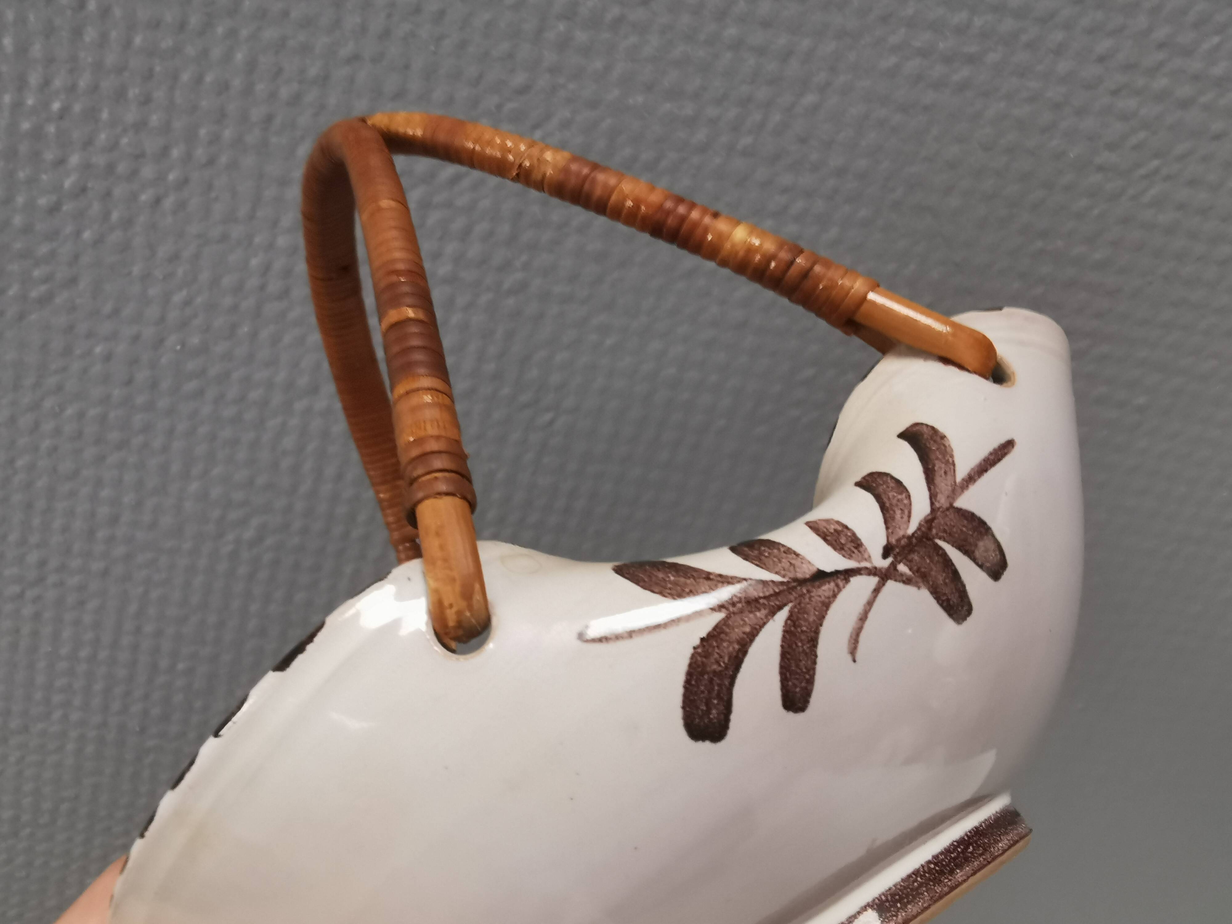 Beautiful small painted ceramic basket with woven handle