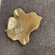 Golden brass bowl in the shape of a vintage leaf from the 1960s, organic design.
