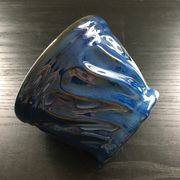 Navy blue stoneware pot.
