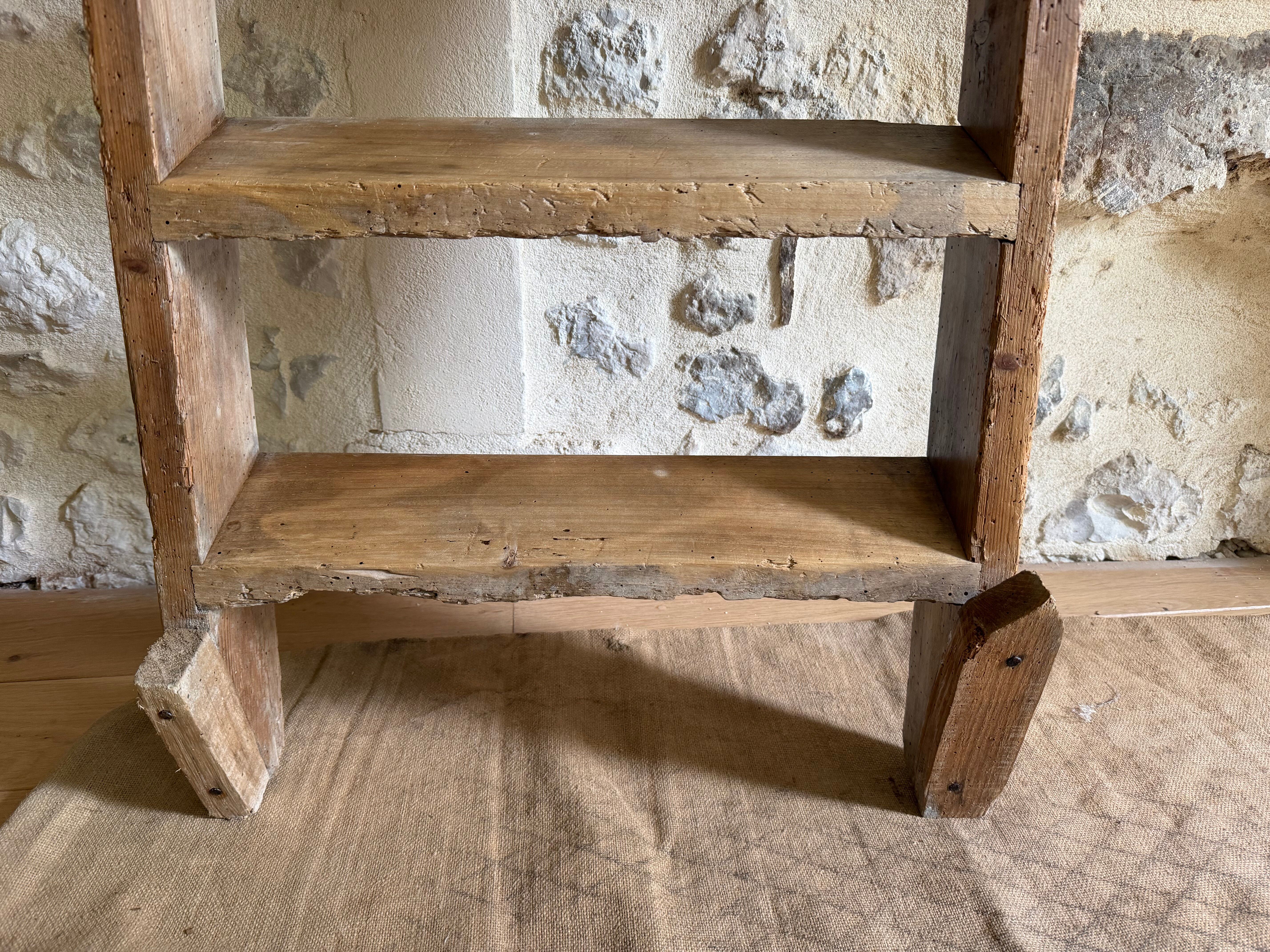 Decorative wooden ladder or towel rack.