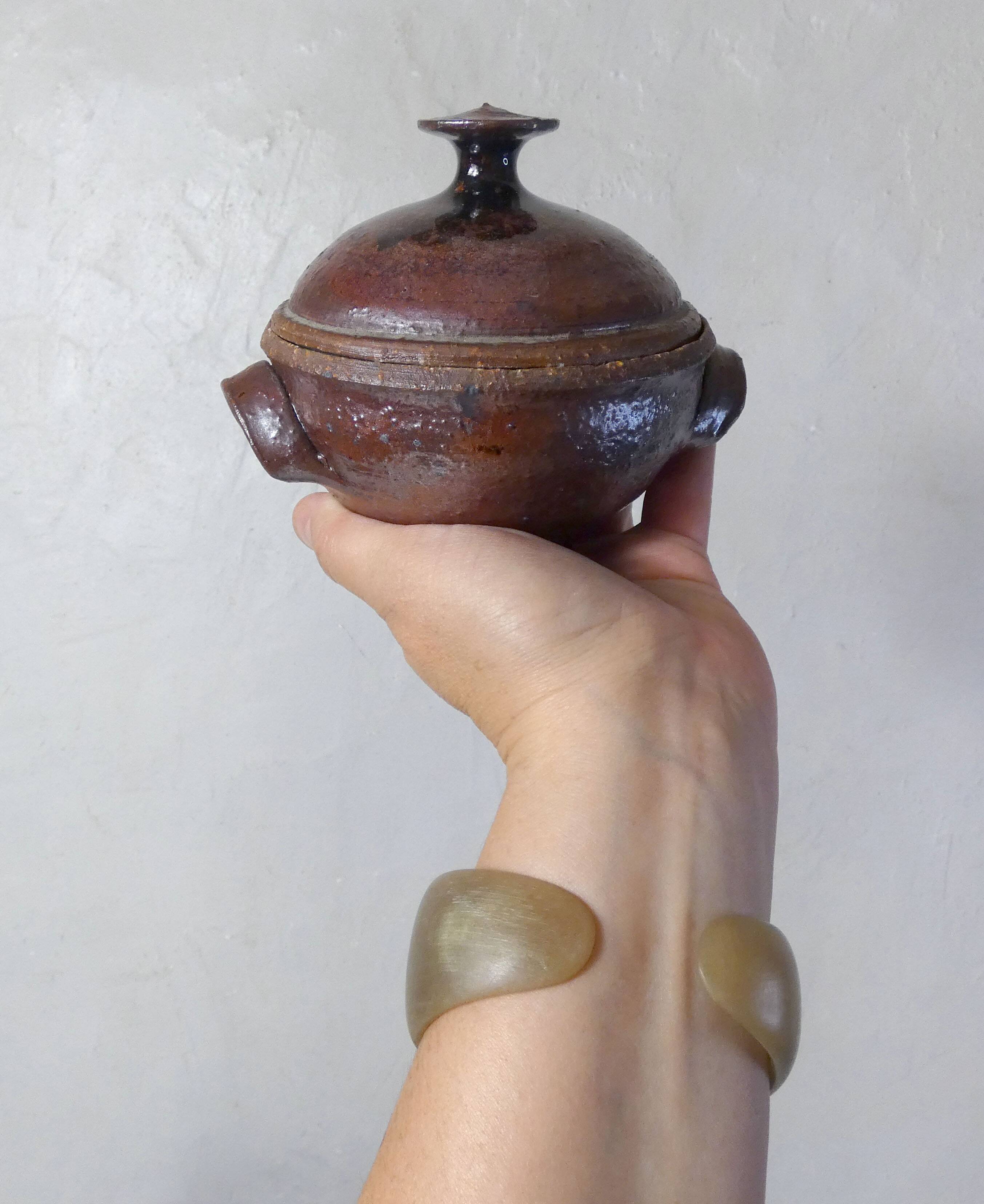 coffee service in iridescent stoneware cups and vintage sugar bowl