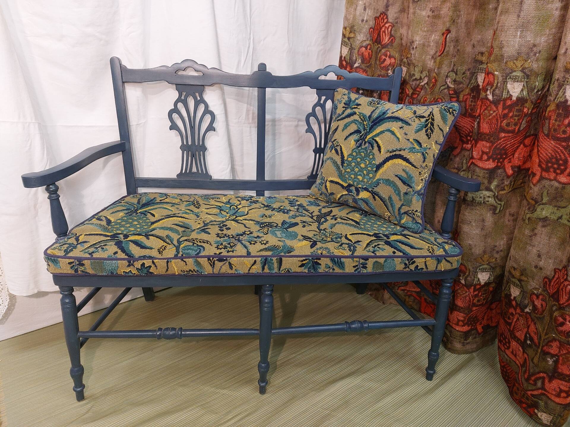 Pretty painted and upholstered bench in green and blue.