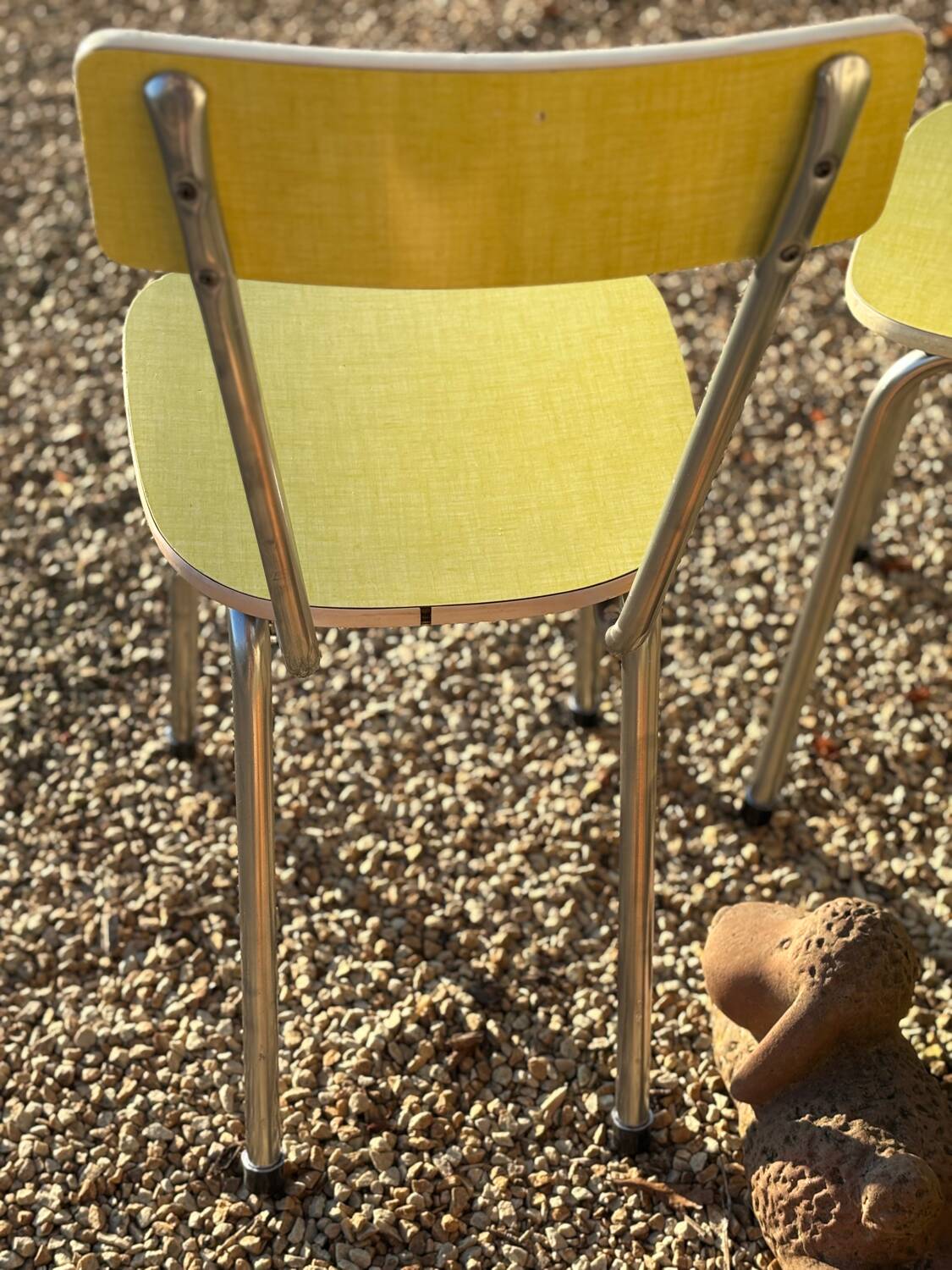 Pair of yellow Formica chairs