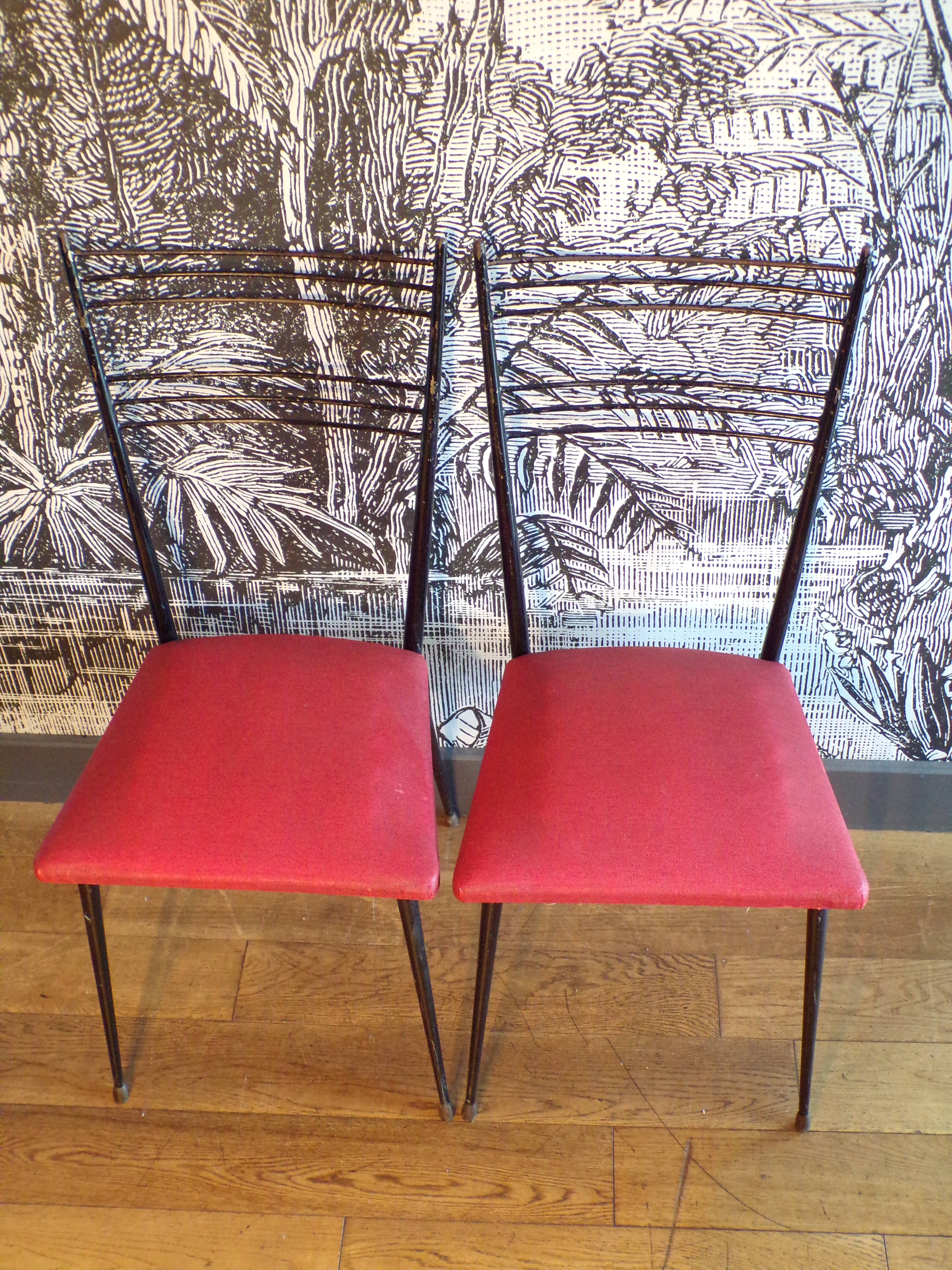 Pair of red Colette Guéden chairs