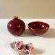 Raspberry-colored ceramic soliflore vase and bowl, enhanced with gilding, Arabia, Finland