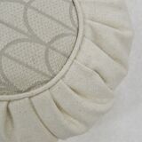 White ruffled cushion