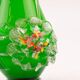Excentric green blown glass vase with relief flowers Murano