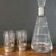 Liquor decanter in crystal and silver metal and matching glasses thereof