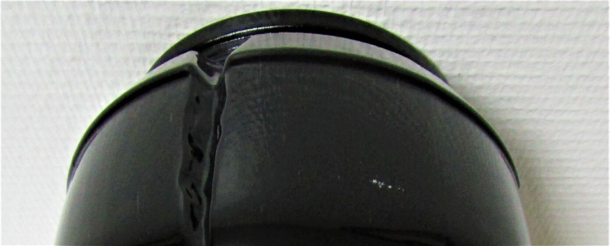 Champagne bucket design black glass in the shape of a 70s cork