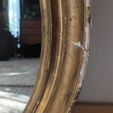 Antique oval gilded stucco mirror