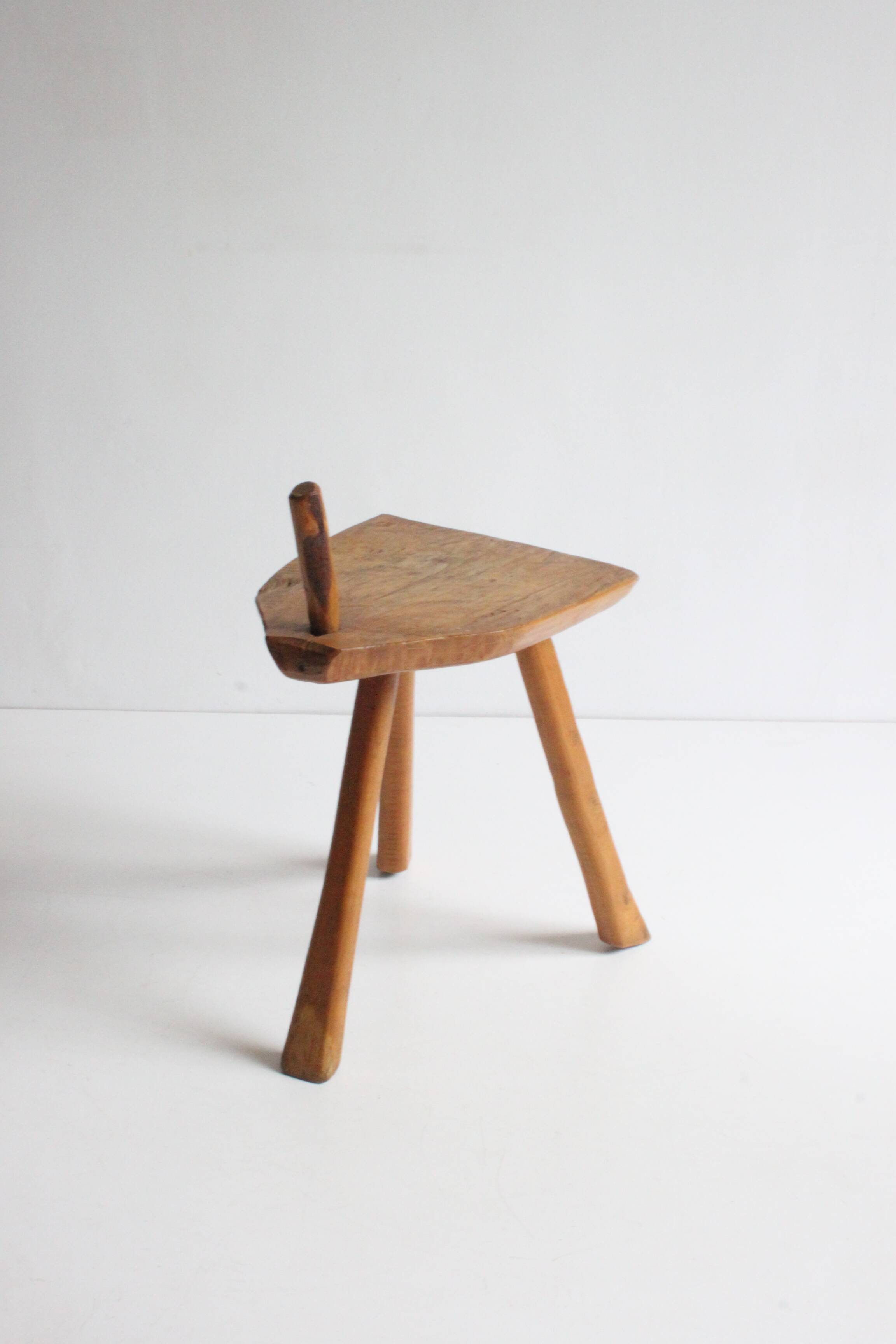 Brutalist tripod stool in carved wood, 1950s
