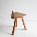 Brutalist tripod stool in carved wood, 1950s