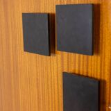 Pair of mahogany veneer and black lacquered iron cabinets. 1950s.