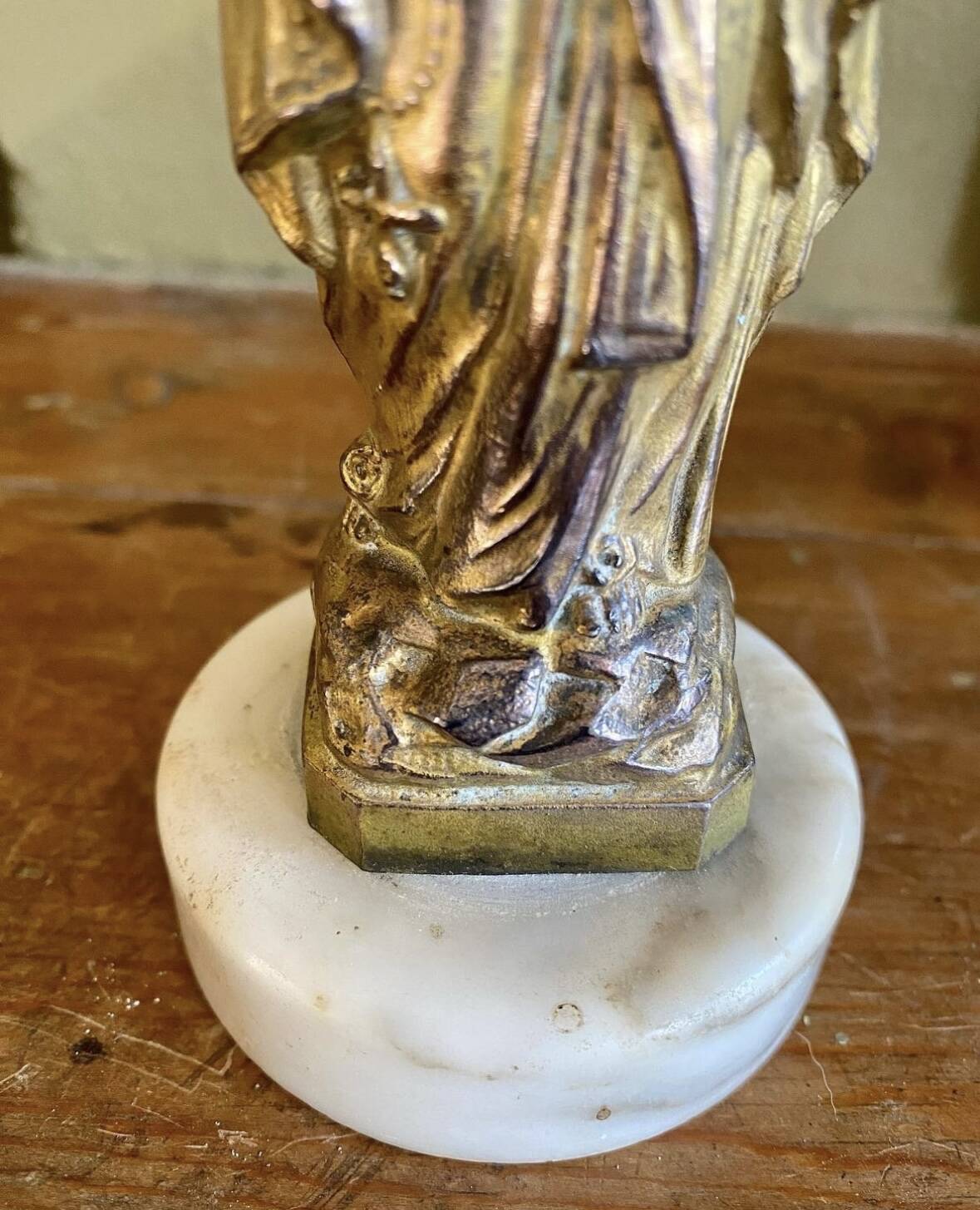 Virgin Mary crowned in metal and brass