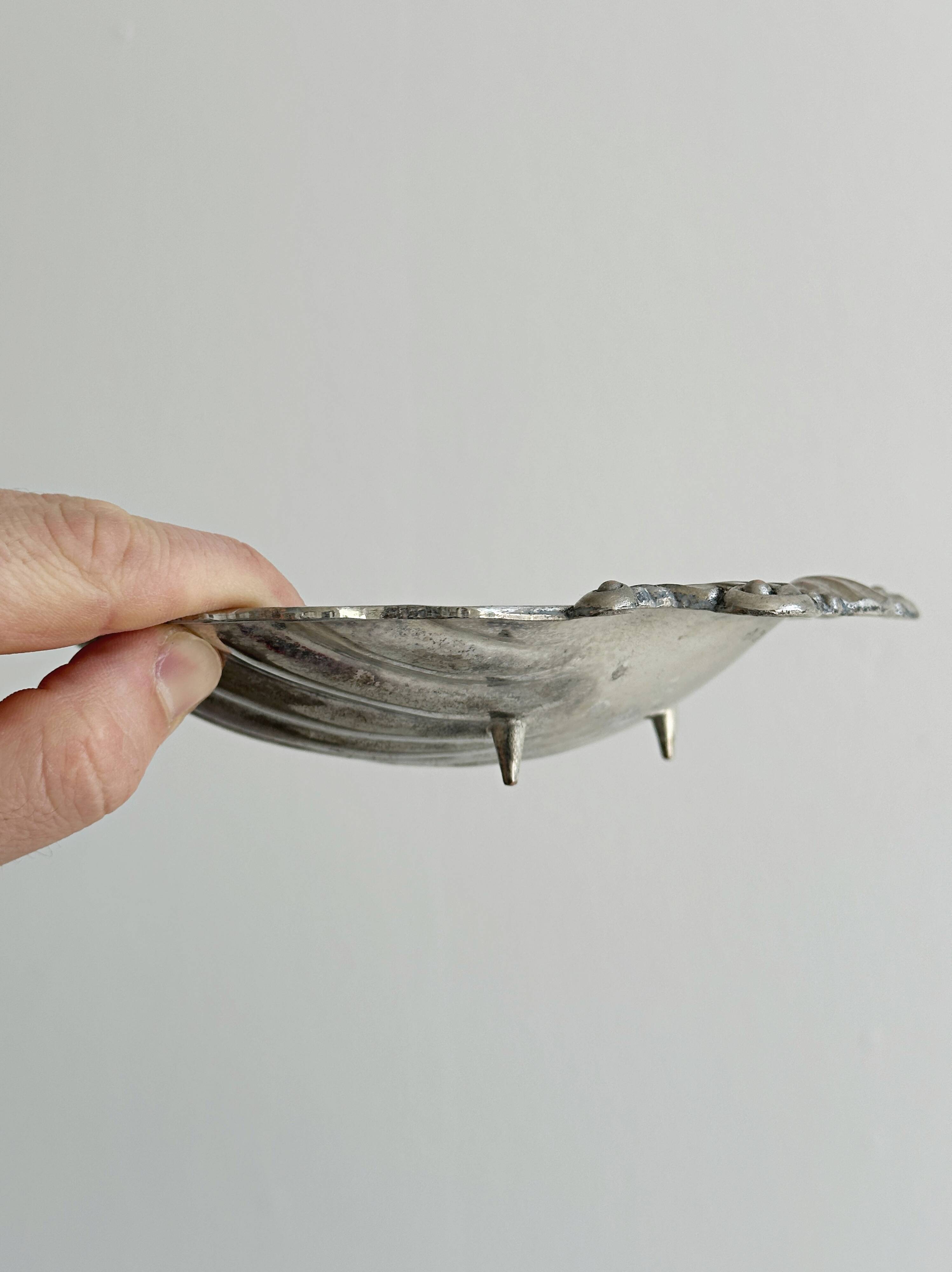 shell-shaped metal pocket tray with patina