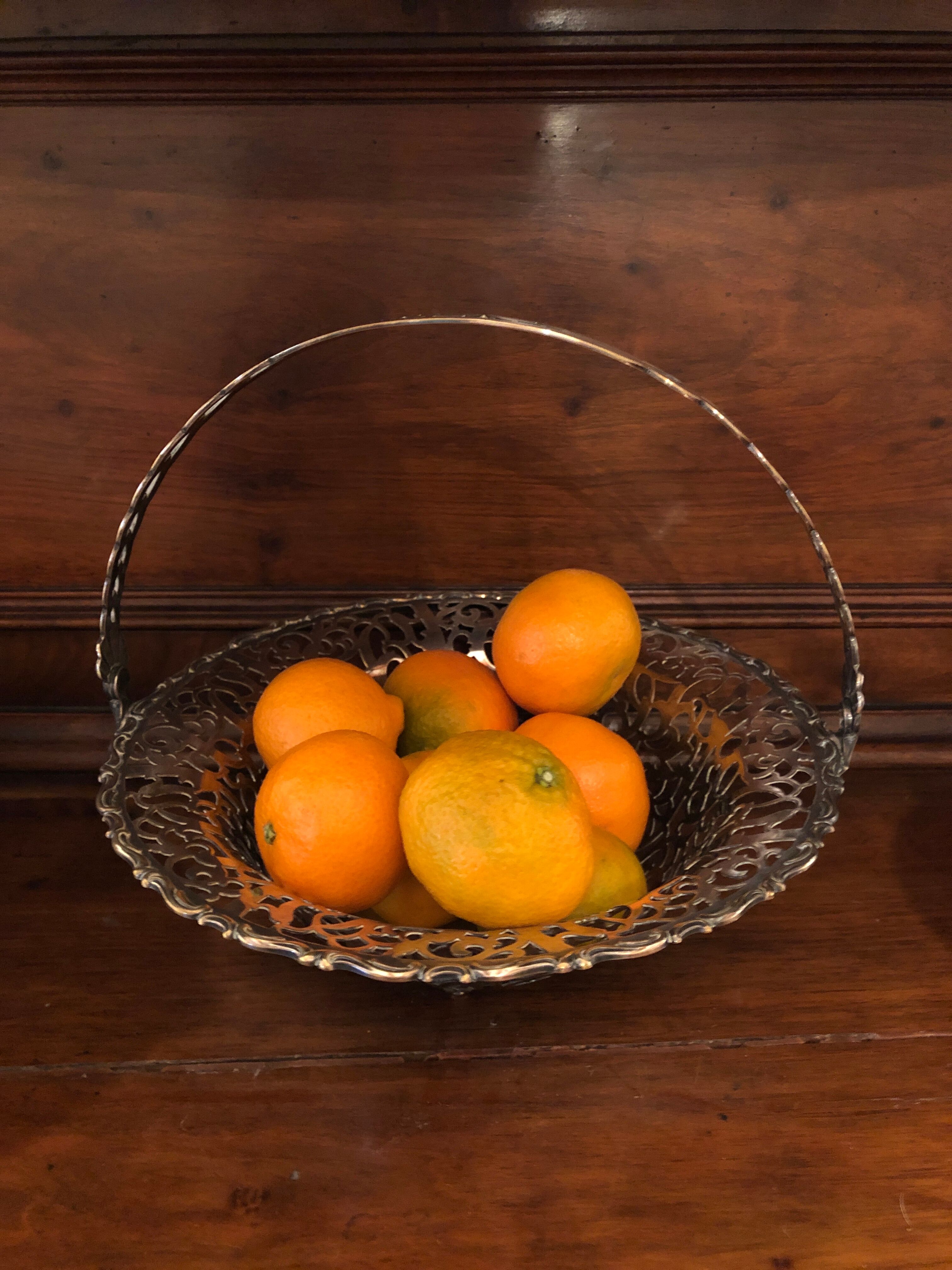 Open silver metal fruit basket
