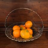 Open silver metal fruit basket