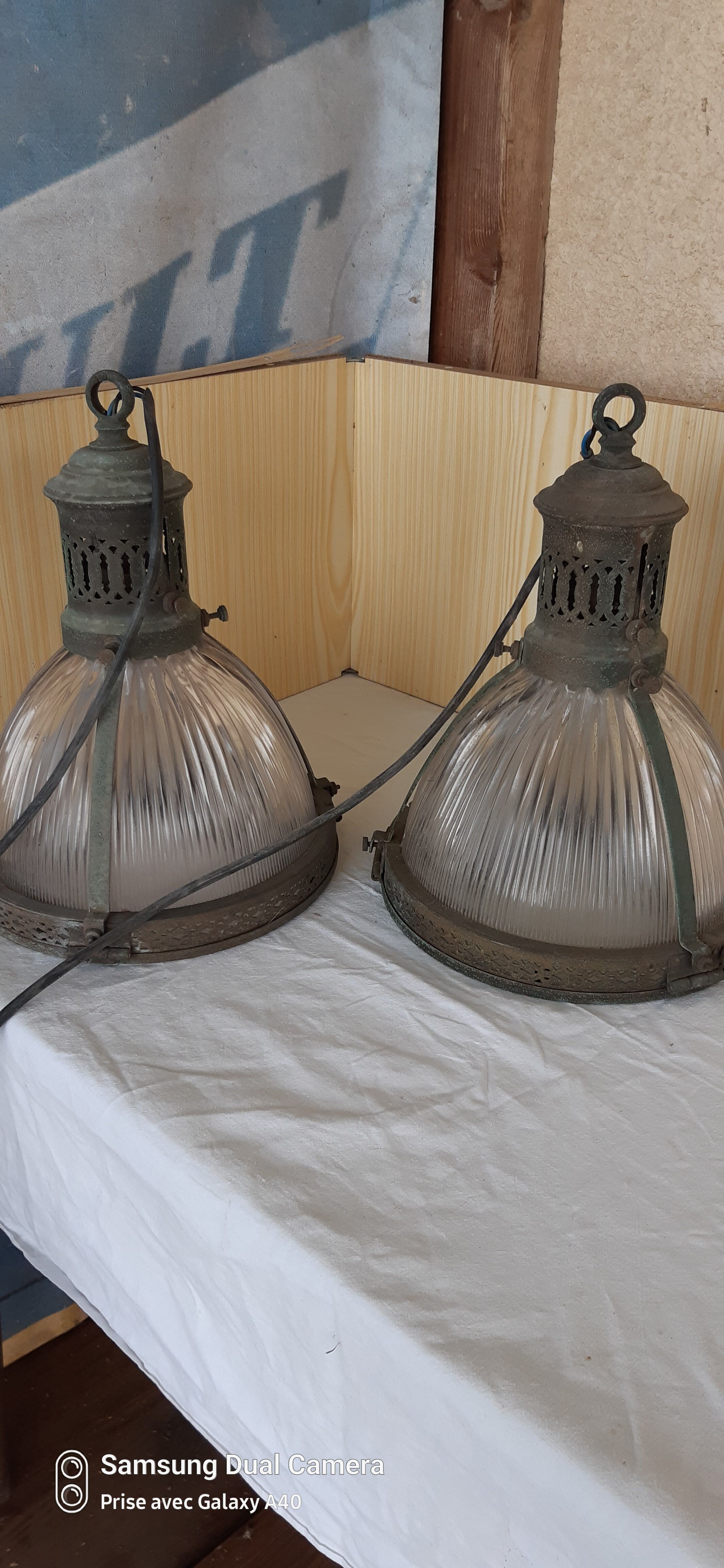 2 holophanous industrial lamps