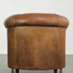 Aged sheepskin clubchair with beautiful vintage patina and comfortable seat