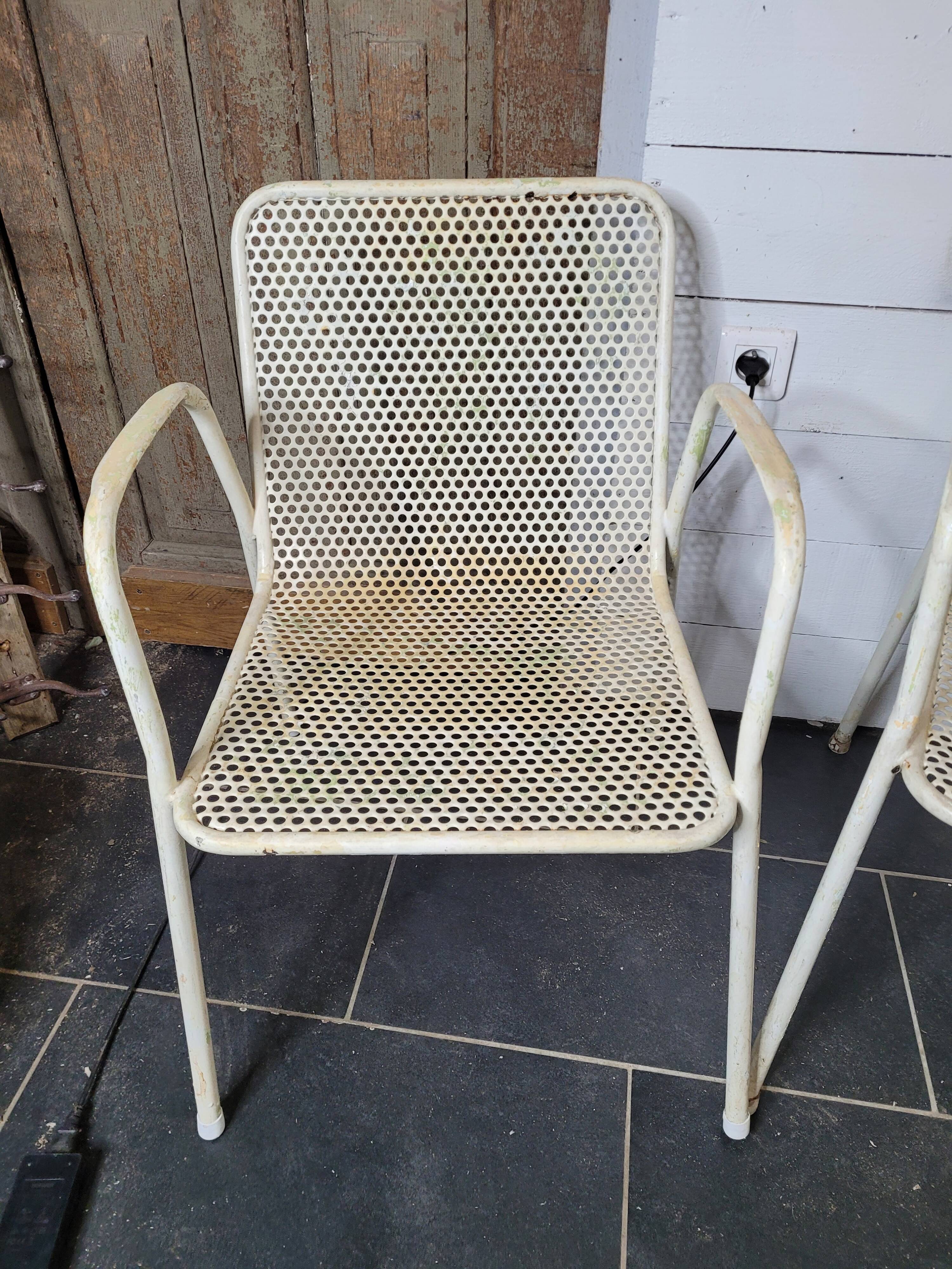 4 perforated metal garden armchairs