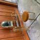 Vintage brown brass dressing table with mirror and matching stool, 1950s - set of 2