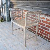 Antique Napoleon III piano bench in wood and cane.