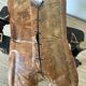Pair of low Egyptian stools, camel saddles in wood, leather and brass