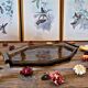 Art deco style black glass tray decorated with leaves