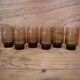 6 Smoked glasses with thick legs from the 70s