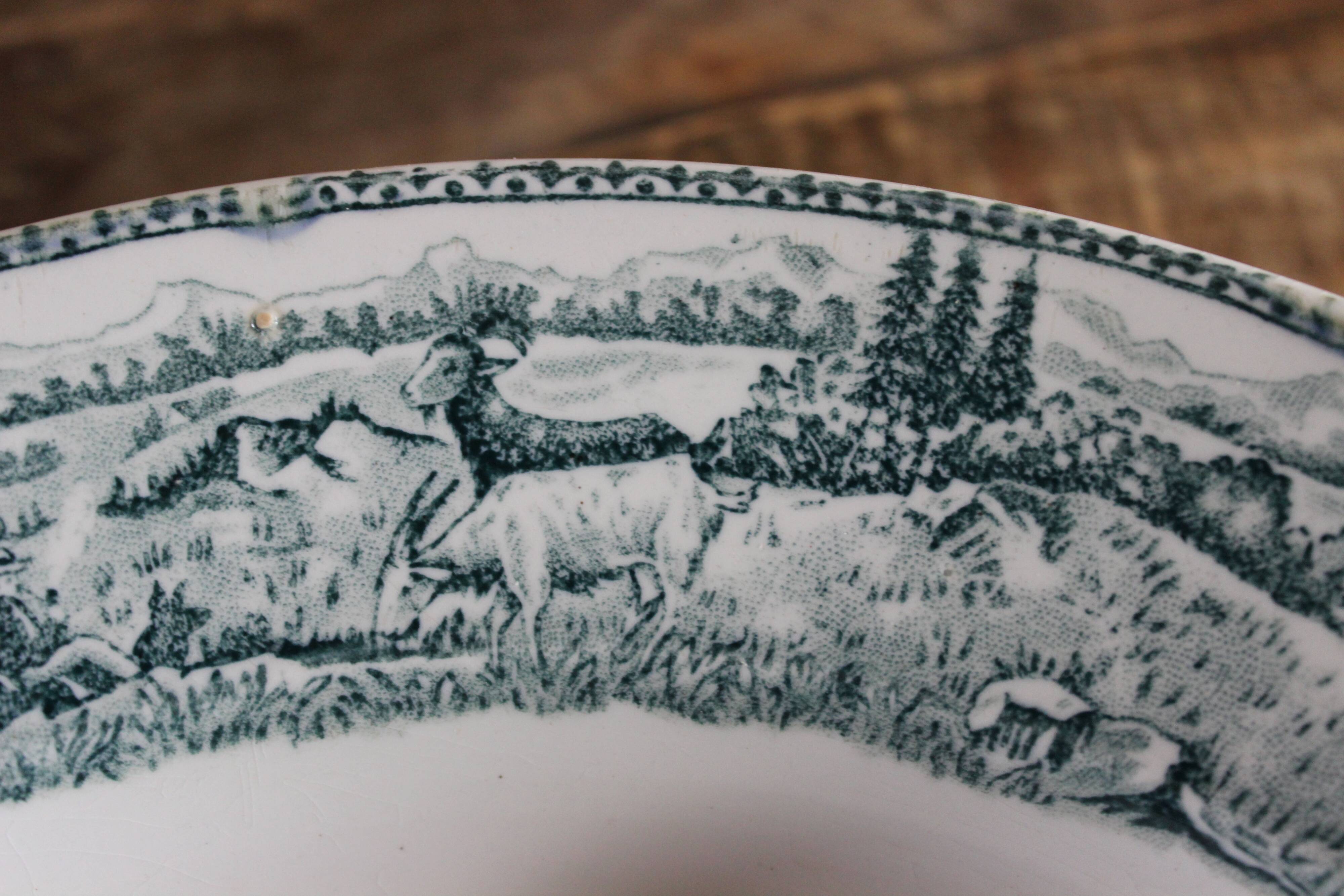 Round hollow dish, Iron earth, Saint Amand, milkmaid model, goat decoration